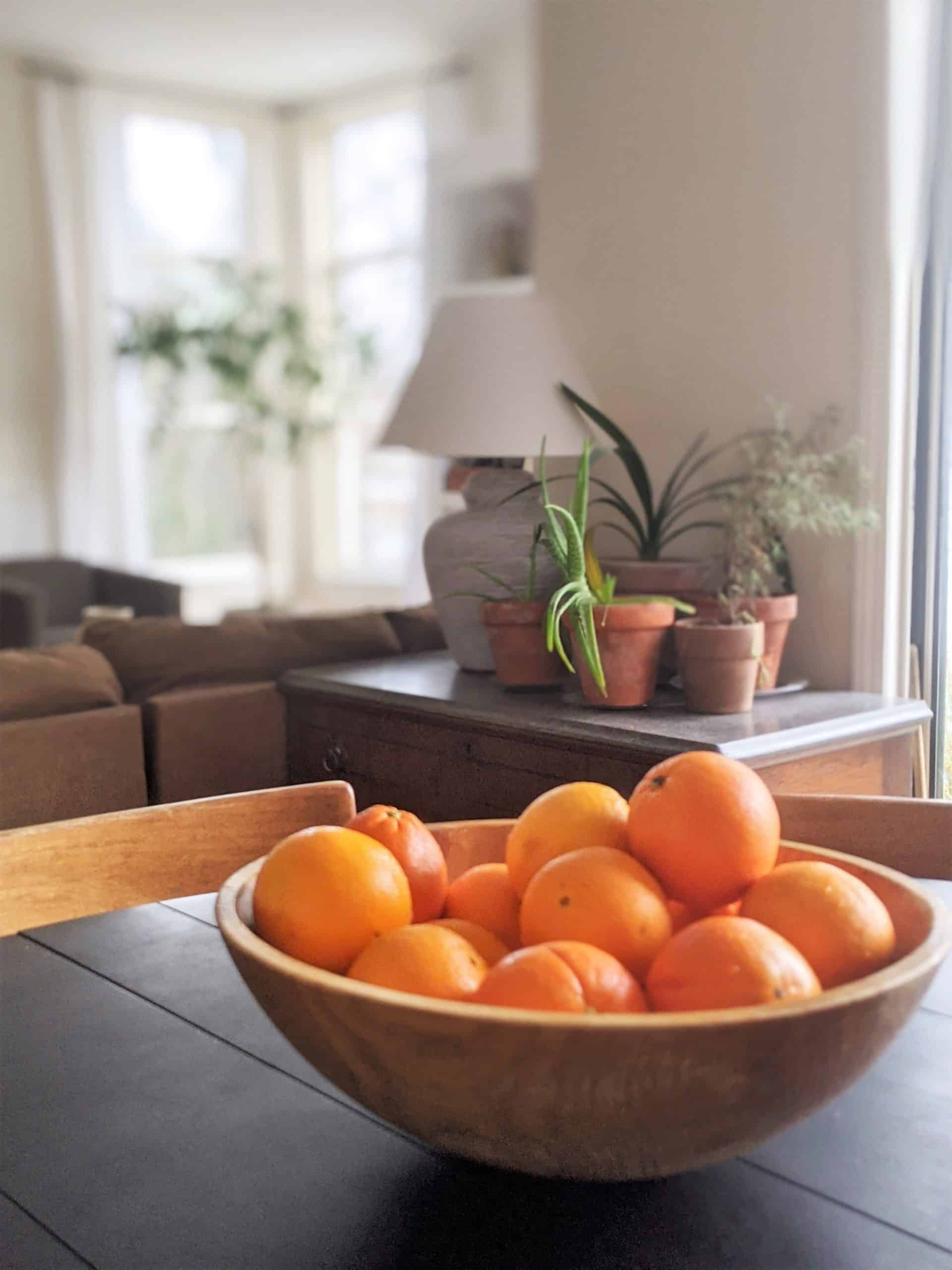 bowl of oranges & dining area