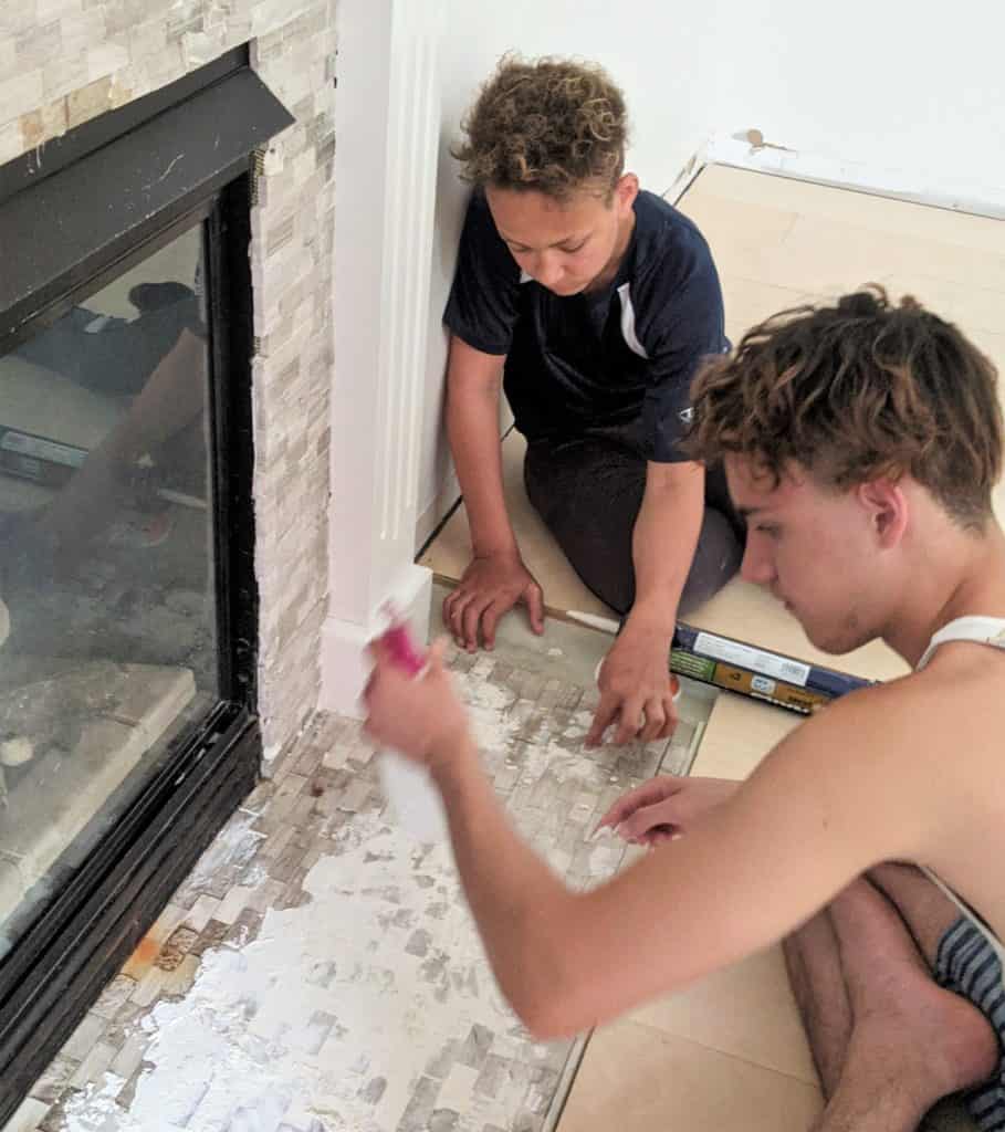 boys working on fireplace