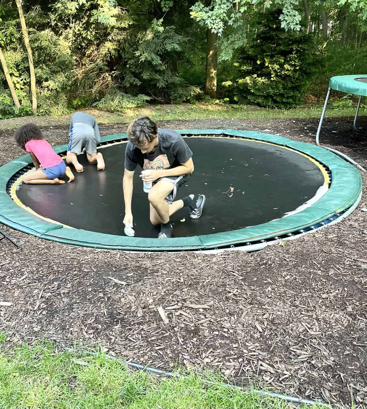 kids cleaning trampoline