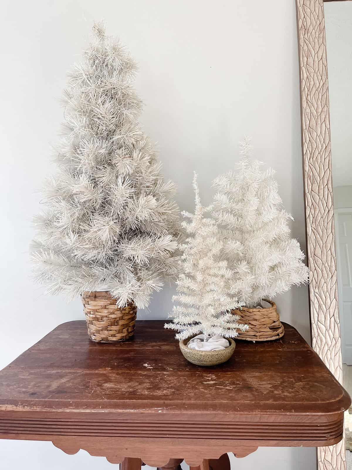 three white christmas trees