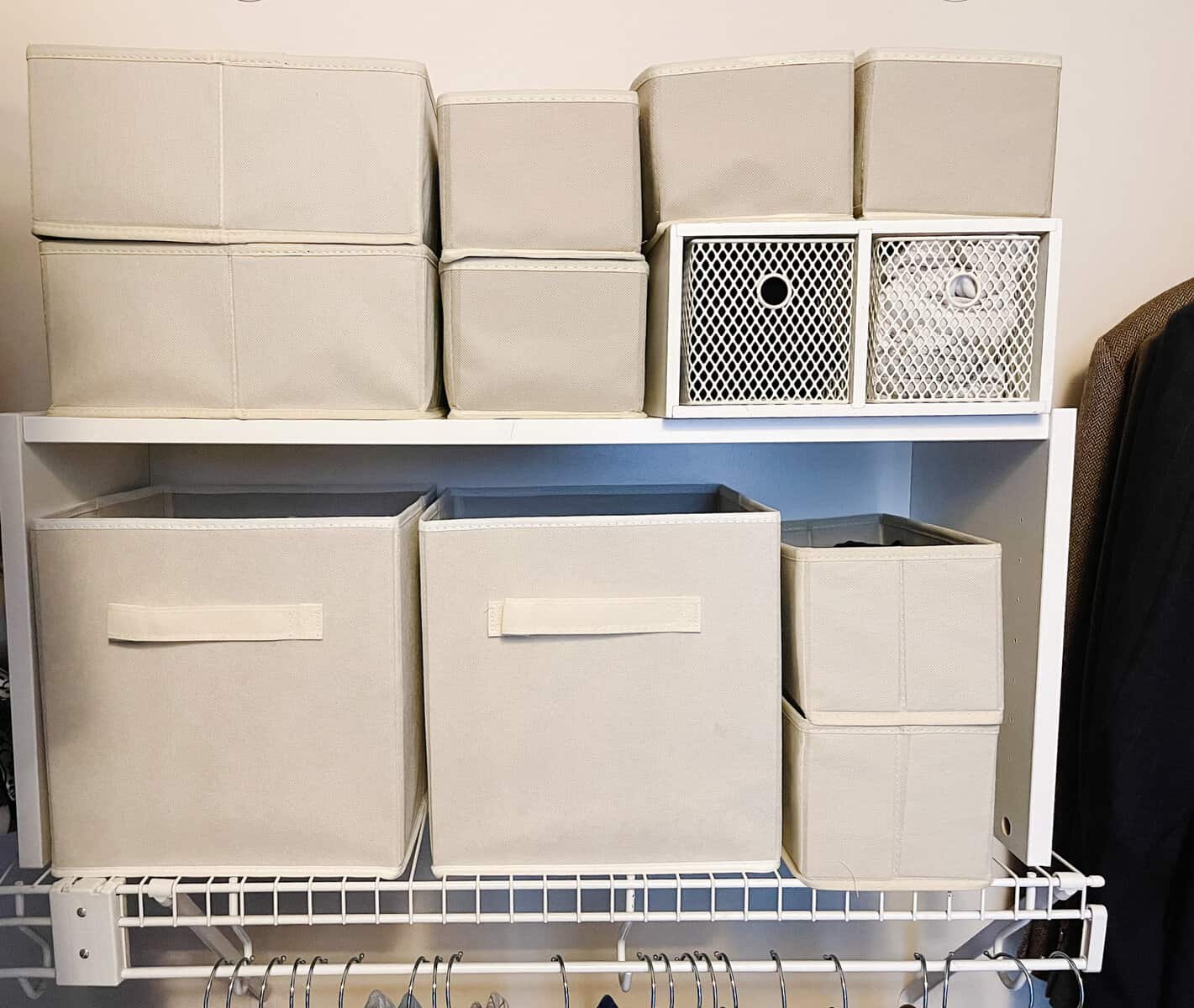 fabric boxes on wire shelf for organization in walk in closet