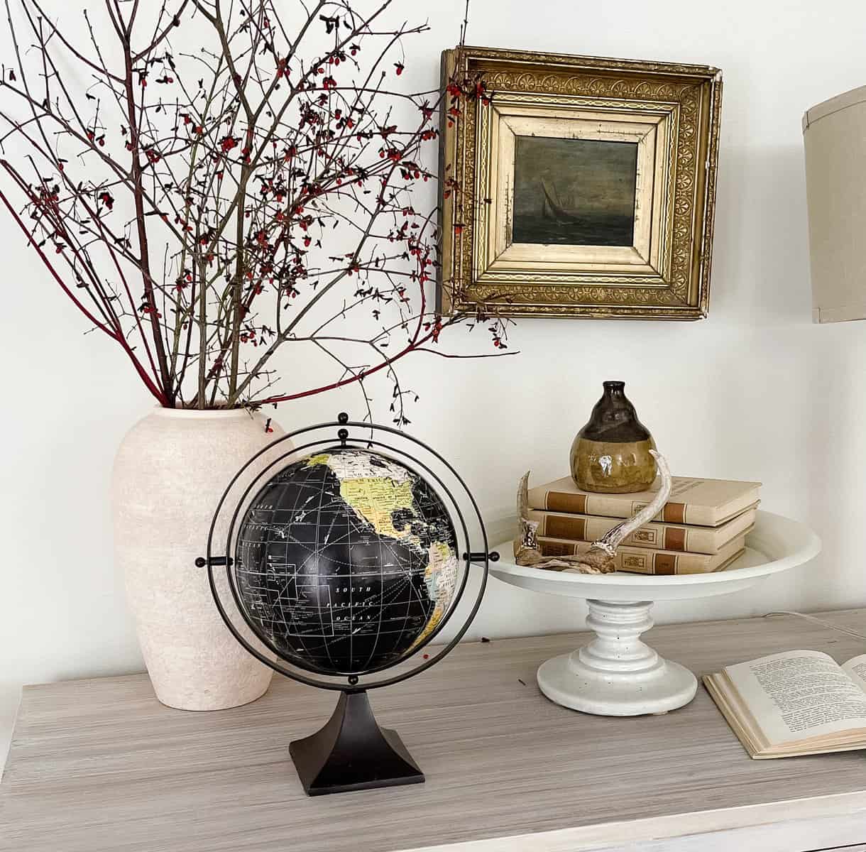 world globe with neutral home decor 