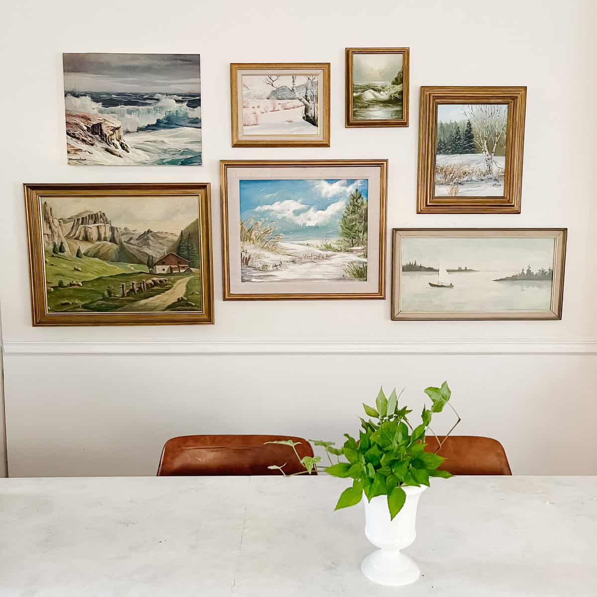 art gallery wall in eating area with island