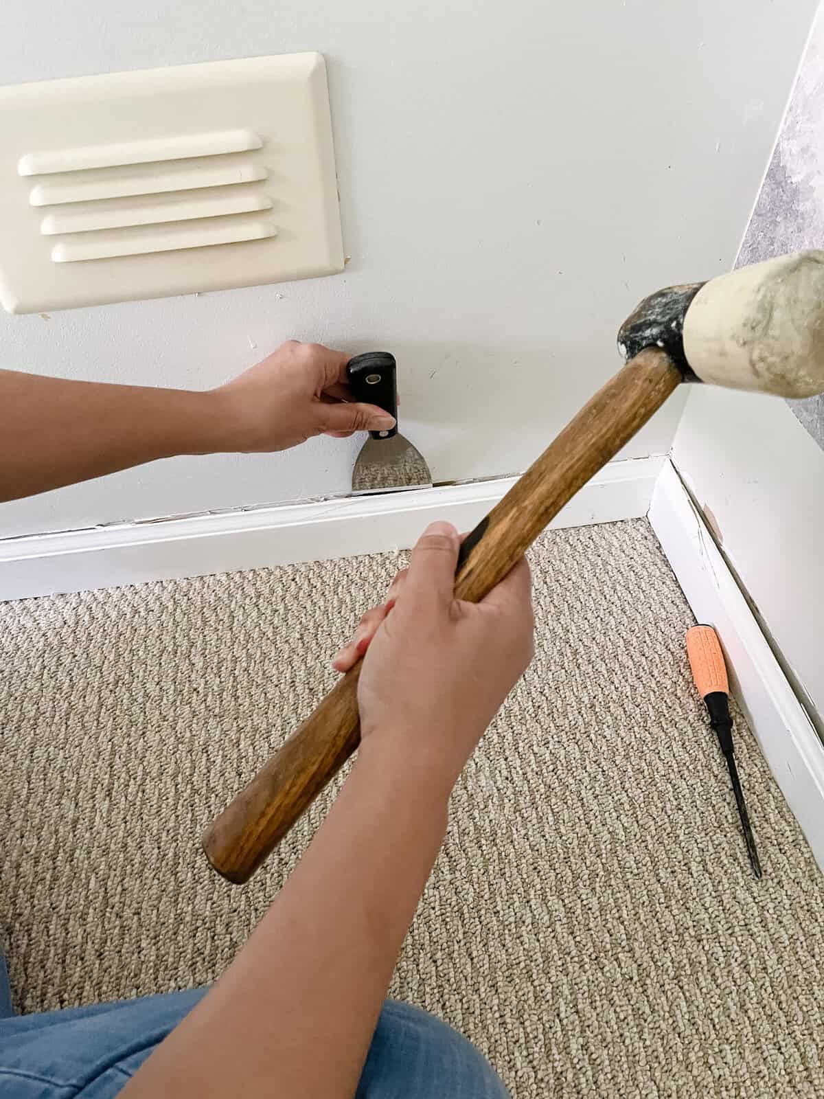 removing baseboards with tools