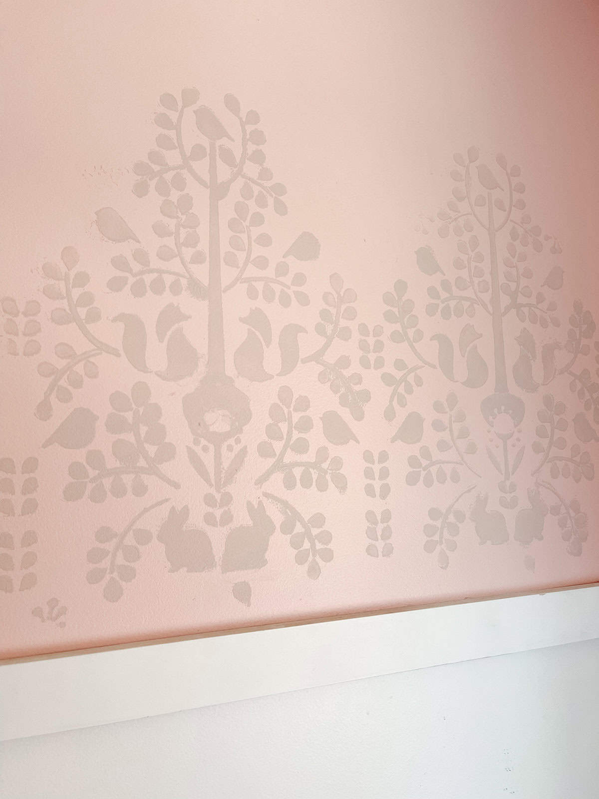 nature stencil on pink girls bedroom wall