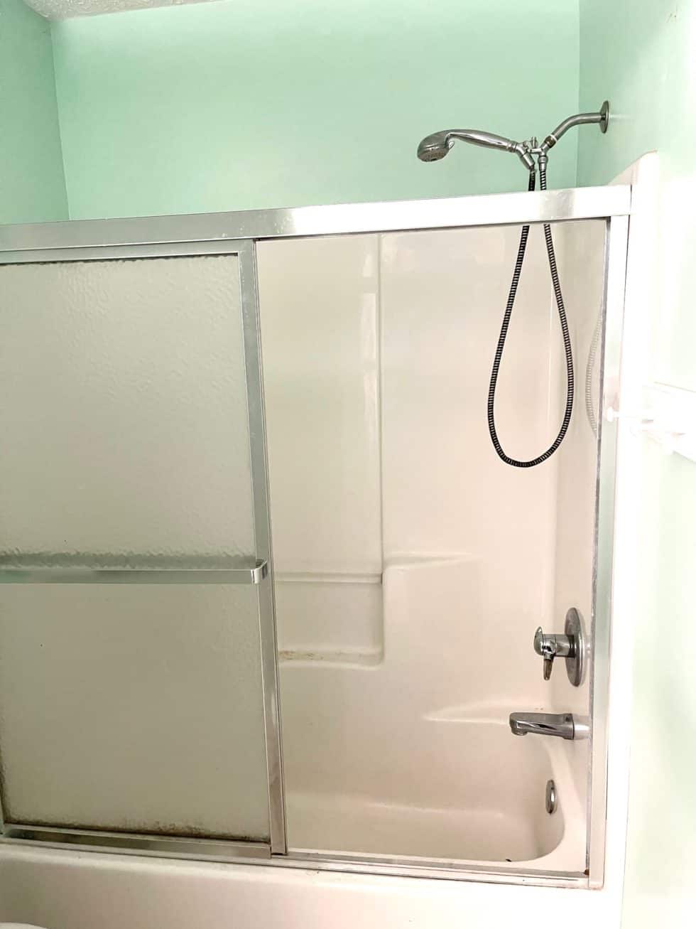 Replacing a Dated Glass Shower Door with a Double Rod and Curtains