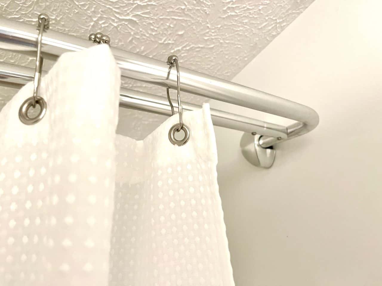 Replacing a Dated Glass Shower Door with a Double Rod and Curtains