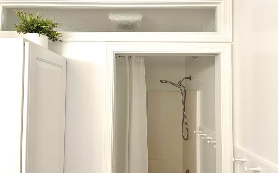 Replacing a Dated Glass Shower Door with a Double Rod and Curtains